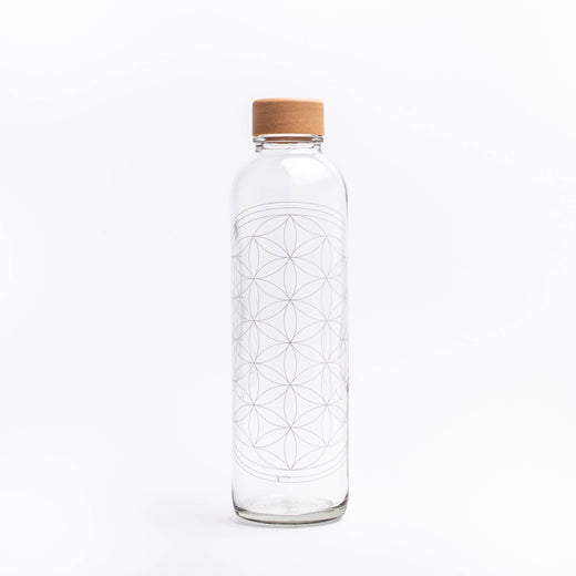 Glastrinkflasche mit weißer Blume des Lebens
